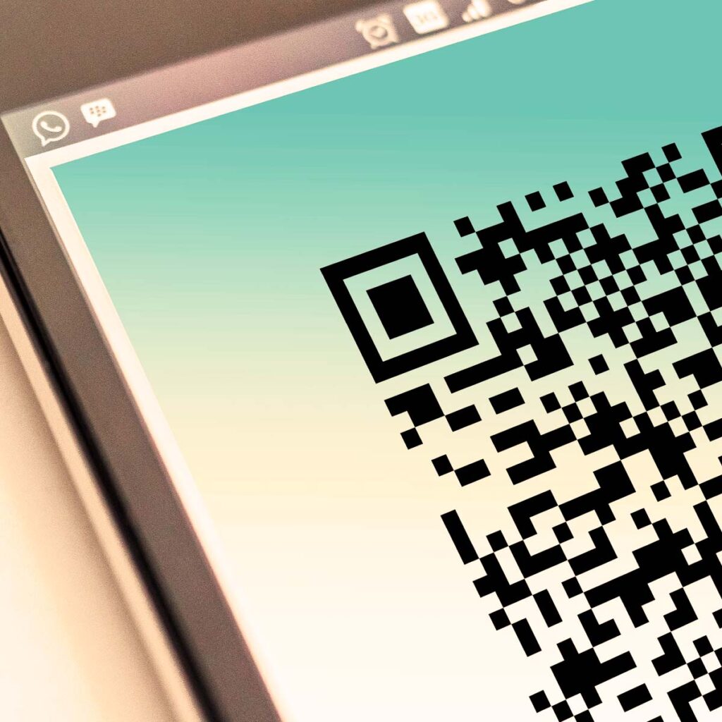 Close up of a highly scannable custom QR code generated for a website URL, displayed clearly on a modern mobile phone screen.